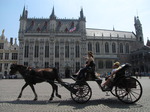 SX15560 Horse and carriage passing town hall in Brugge.jpg